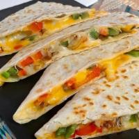 Veggie Quesadilla · Grilled peppers and onions with melted cheese in a grilled flour tortilla. Served with a sid...