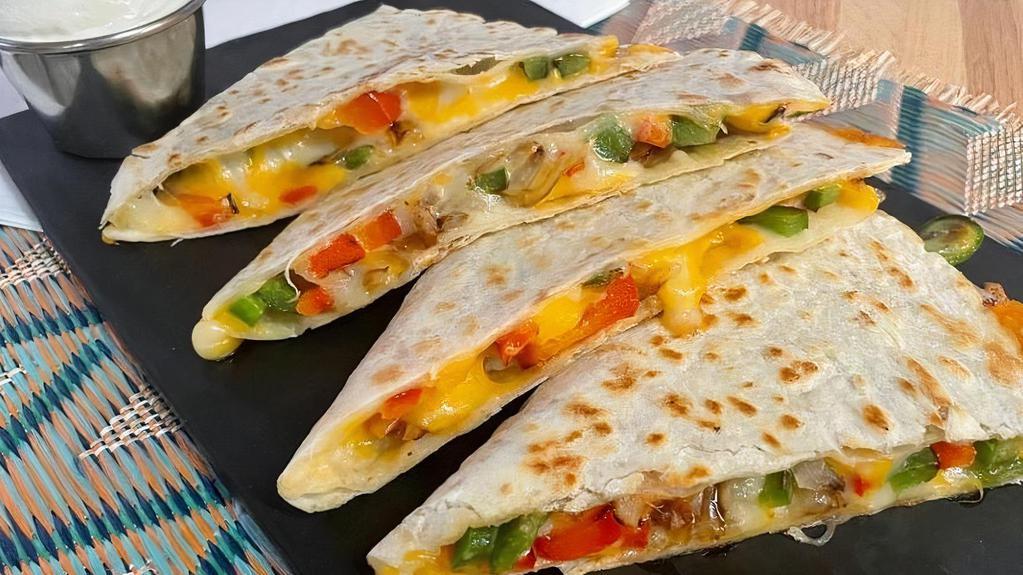 Veggie Quesadilla · Grilled peppers and onions with melted cheese in a grilled flour tortilla. Served with a side of sour cream.