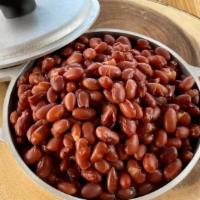 Beans · Our made from scratch beans, your choice of red or black beans.