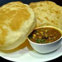 Chole Bhature · Chickpea curry served with puffed Indian deep fried bread.