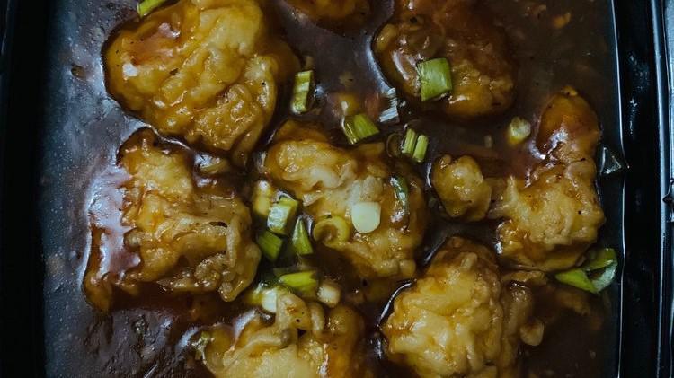 Gobi Manchurian · Fried cauliflower chopped in sweet, tangy & slightly spicy sauce, comes with rice.