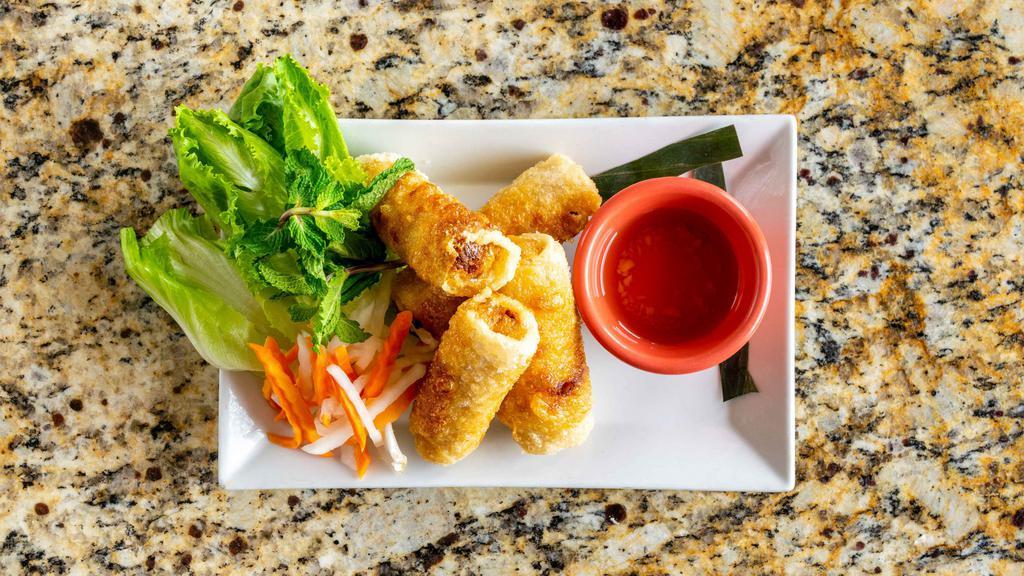 Fried Spring Rolls (4 Rolls) (Chả Giò) · Popular dishes. Ground pork, chicken, vermicelli, onions, carrots, and taro, wrapped in rice paper, served with lettuce, mint leaves and house fish sauce.