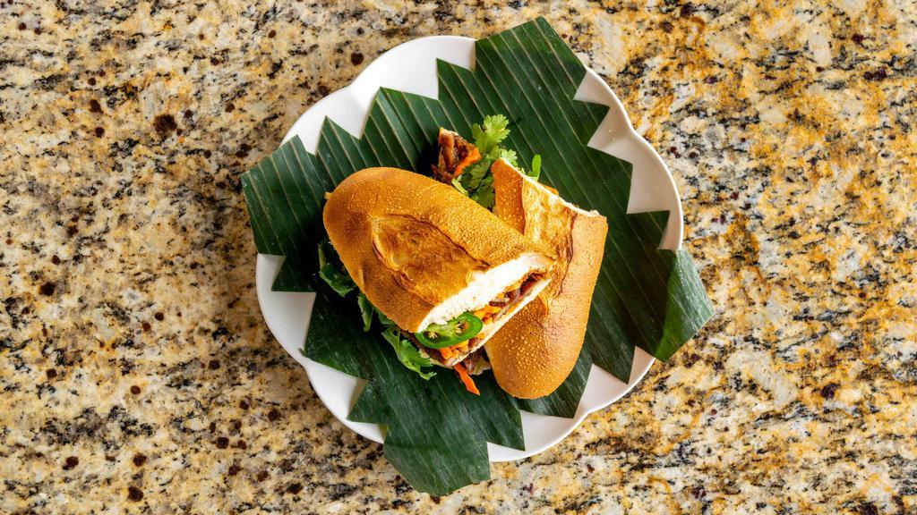 Bánh Mì Classic (Bánh Mì Đặc Biệt) · With pork belly, pate, and pork ham filings.