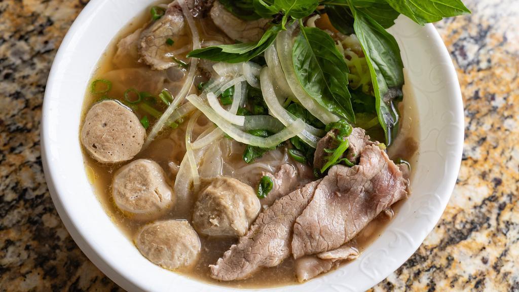 Rice Noodle Soup With One Choice Of Beef · Served in a traditional beef broth with onions, scallions and cilantro.