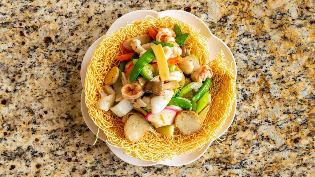 Pan Fried Noodles With Seafood (Mì Xao Hai San) · Popular dishes. Stir fried egg noodles crispy or soft filled with shrimp, squid, fish cakes, mushrooms and vegetables.
