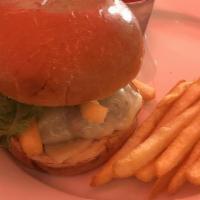 Burger · Lettuce, tomato and onion served on a brioche bun with a side of fries.