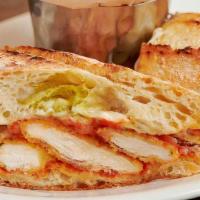 Chicken Parmesan Sandwich · Panko crusted chicken breast topped with house marinara and mozzarella cheese served on ciab...