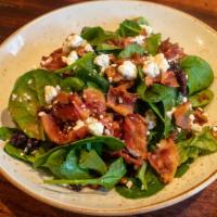 Spinach · Applewood bacon, walnuts, dried cranberries, goat cheese, and raspberry vinaigrette.