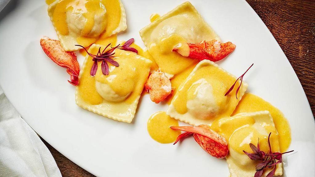 Homemade Lobster Ravioli · Spinach, lobster meat, and saffron cream.