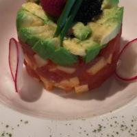 Tuna Tartar · Mixed mango, avocado, and caviar. Raw and under cooked food.