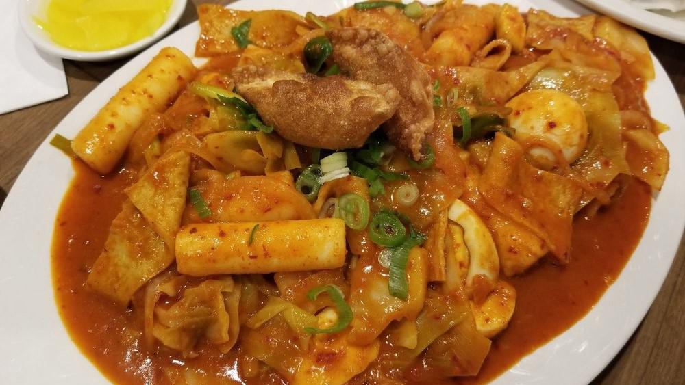 Ddukbokki (떡볶이) · Spicy rice cakes stir fried in a spicy sauce with fish cakes.