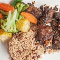 Jerk Chicken · Served with rice and peas, white rice.