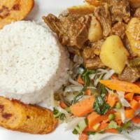 Goat Curry · Served with rice and peas, white rice, or provision.