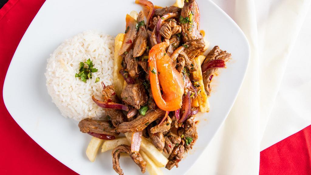Lomo Saltado · Popular. Your choice of meat seasoned and sautéed with red onion and cilantro with steamed white rice and steak fries.