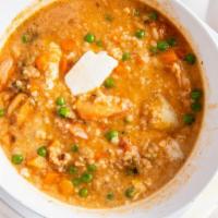 Chupe De Camaron · Traditional shrimp gumbo with egg and crumbled queso fresco.