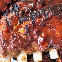 Baby Back Ribs  · Slow cooked large pork ribs served with seasoned French fries