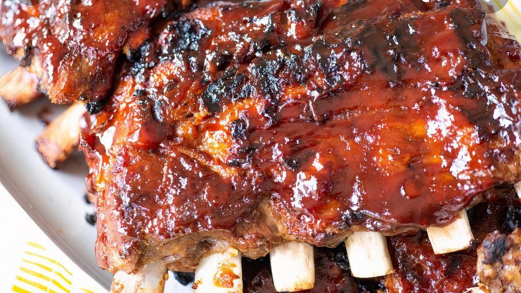 Baby Back Ribs  · Slow cooked large pork ribs served with seasoned French fries