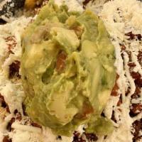 Nachos · Tortilla chips with beans, jalapeños, your choice of filling, topped off with  sour cream, c...