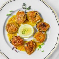 Clams Al Forno · Baked clams oreganata, topped with
breadcrumbs, oregano and garlic, Served over
scampi sauce