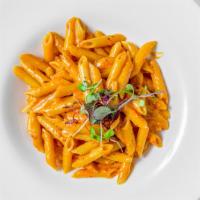 Penne Alla Vodka · Penne pasta with vodka, parmesan cheese,
shallots, basil in a tomato cream sauce
