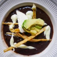 Sopa Tarasca · Cream of black bean soup, with a touch of chipotle, crispy tortilla strips, queso fresco and...
