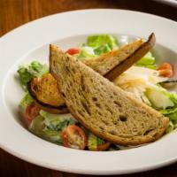 Gem Caesar Salad · baby lettuce, anchovies, Greek yogurt, Caesar dressing, shaved Parmesan.