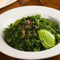 Kale Salad · quinoa, avocado, ginger-pomegranate vinaigrette.