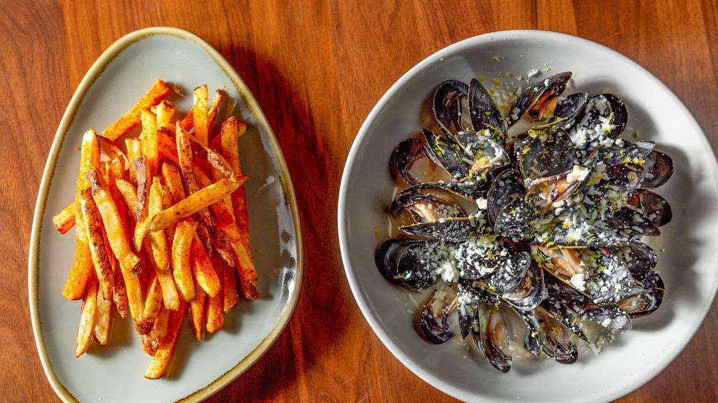 Greek Mussels · garlic & feta cream broth, paprika fries.