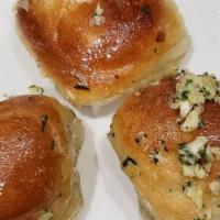 Garlic Knots (6) · A classic snack our garlic knots are strips of pizza dough tied in a knot baked and then top...