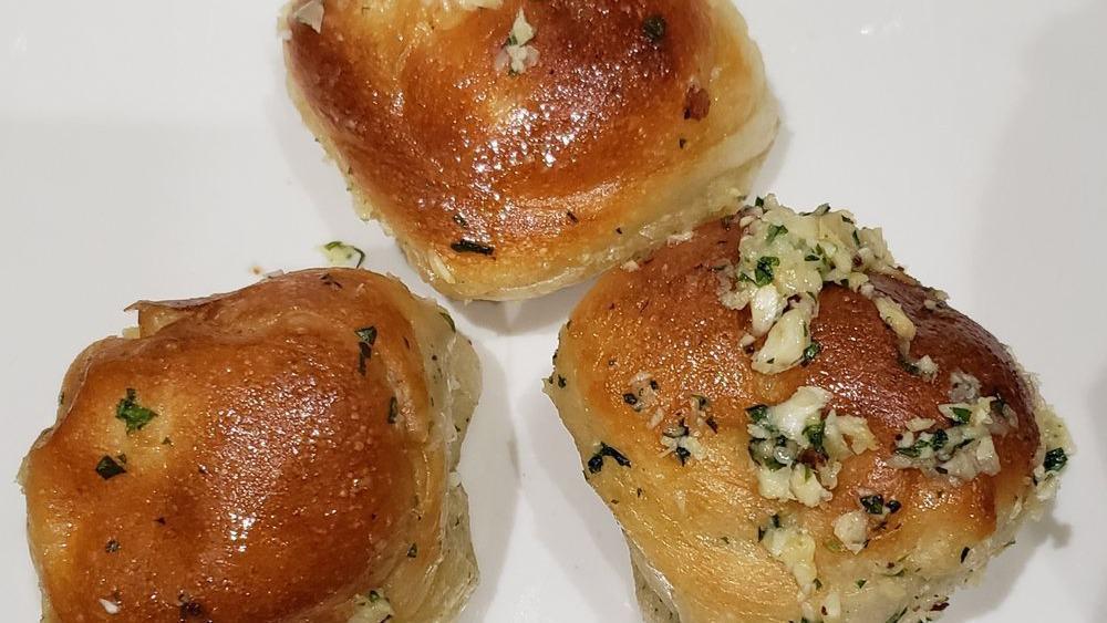 Garlic Knots (6) · A classic snack our garlic knots are strips of pizza dough tied in a knot baked and then topped with melted butter garlic and parsley.