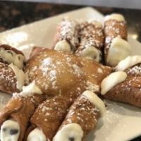 Cannoli · Delicious tube of fried dough filled with a sweet and creamy ricotta filling.