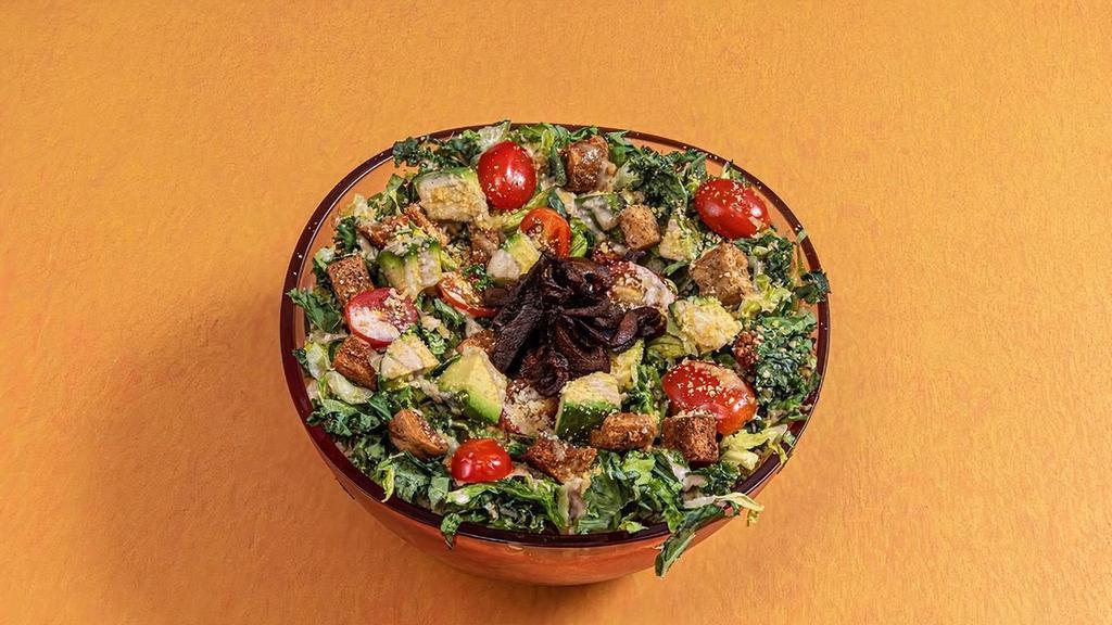 Kale Caesar · Our take on a classic fav with our famous shiitake bacon and creamy, dreamy caesar dressing. Ingredients: Kale, Romaine, Shiitake Bacon, Tomato, Avocado, Almond Parm, Maple Croutons, Caesar Dressing. . Contains: Soy, Treenuts