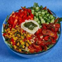 Burrata Bliss · Summer in a salad. INGREDIENTS: Arugula, Romaine, Corn Succotash, Vegan Burrata, Red Pepper,...