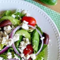 Greek Salad · Mixed greens, tomatoes, cucumbers, Kalamata olives, sliced red onions & crumbled feta cheese...
