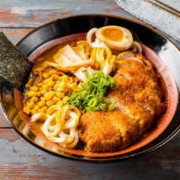 #11 Fried Pork Tonkatsu Curry Ramen · Fried Pork Tonkatsu,  1/2 marinated egg, bamboo shoots, corn, wakame, scallions and nori.