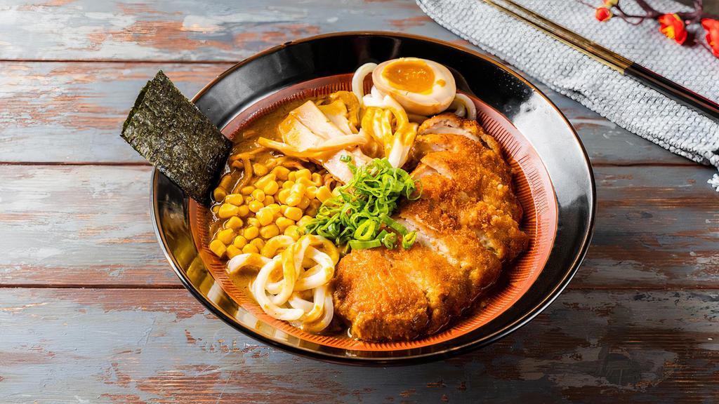 #11 Fried Pork Tonkatsu Curry Ramen · Fried Pork Tonkatsu,  1/2 marinated egg, bamboo shoots, corn, wakame, scallions and nori.