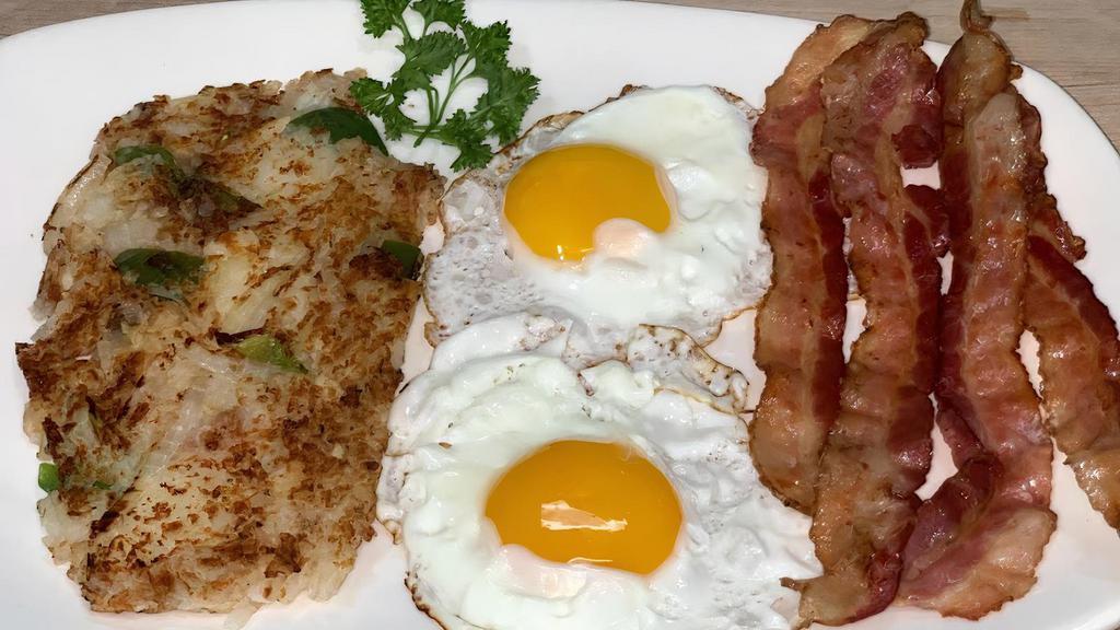Two Eggs Any Style With Bacon, Ham, Pork Sausage Or Canadian Bacon · 