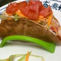 Single Taco Hard Shell · Served with lettuce, tomato, cheese and sour cream.