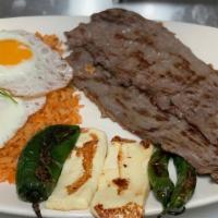T-Bone Steak · Served with rice, beans, salad and tostones.
