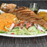 Pargo Rojo Frito · Fried red snapper served with salad, tostones, rice and beans.