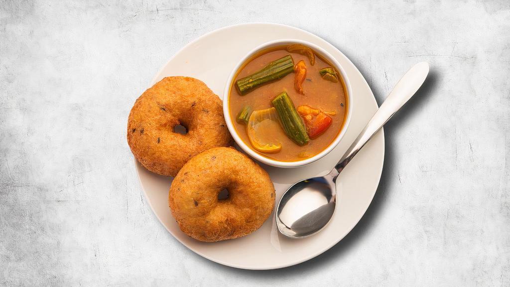 Black Gram Doughnuts · 2 pieces. A popular South-Indian breakfast fritter made with urad dal, spices, and curry leaves. Served with a lentil soup, a tangy tomato, and classic coconut relish