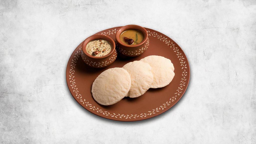 The Incredible Idli (3 Pcs) · 3 steamed savory rice cakes served with a lentil soup, a tangy tomato and classic coconut relish.