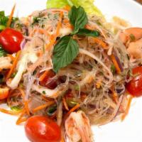 Yum Woon Sen (Glass Noodle Salad) · Calamari, shrimp, red onion, glass noodles, peanut, carrots, scallion, tomatoes, fresh chili...