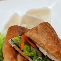 Viet Steak Sandwich · Five-spice marinated flank steak, sauteed sweet onions, cilantro cream, on toasted baguette ...