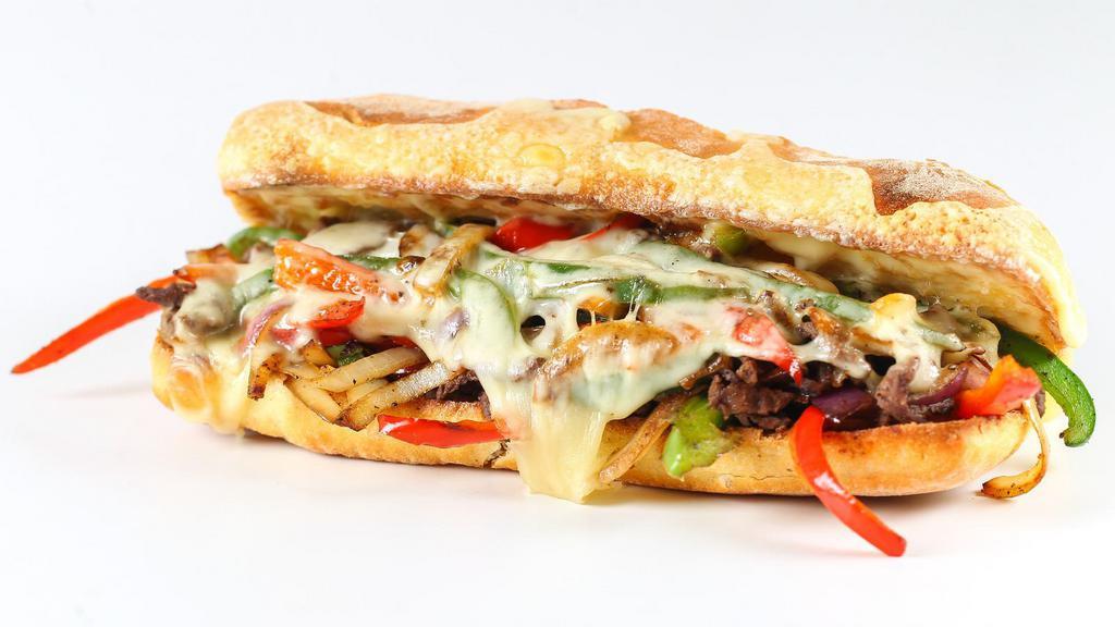 Chopped Cheese Sandwich · Sandwich made on a grill with ground beef, onions, and topped by melted cheese and served with lettuce, tomatoes, and condiments on a hero roll.