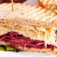 Reuben Sandwich · Hot pastrami sandwich with Swiss cheese, sauerkraut and mustard.