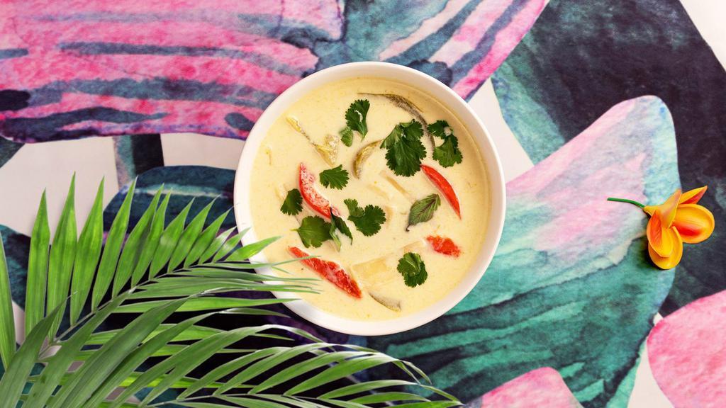 Green Curry · Coconut milk, bamboo shoots, and sweet basil curry with your choice of tofu or vegetables.