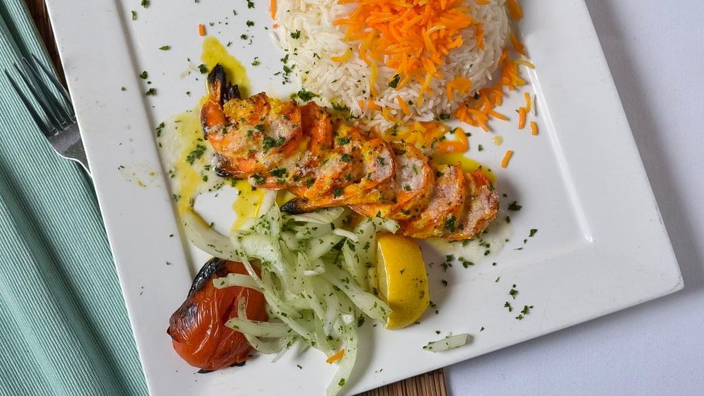 Shrimp Kebab · Grilled jumbo shrimp lightly marinated in house seasoning topped with lemon-garlic sauce.