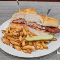 Schnitzel Club · Breaded pork cutlet with horseradish sauce and tomato served on a club roll.
