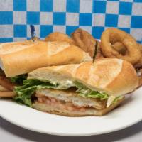 Fish Club · Fried fish with lettuce, tomato, and tartar sauce on a club roll.